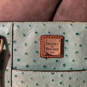 Beautiful D$B teal colored purse. Greatt in shape . Very littlee wear .